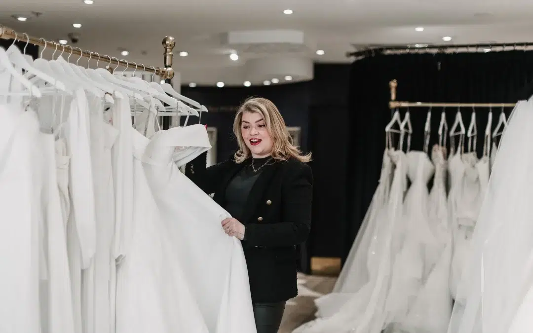 Sian looking at wedding dresses during a bridal appointment.