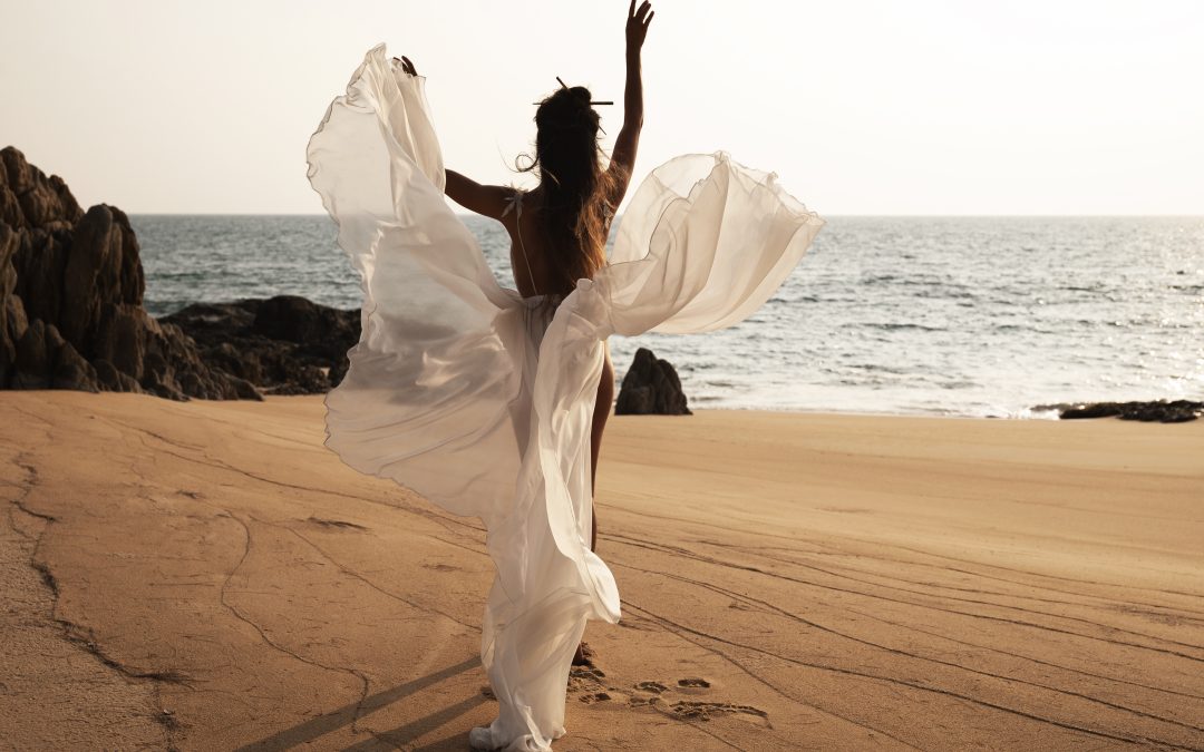 Bride on a beach in a beach wedding dress